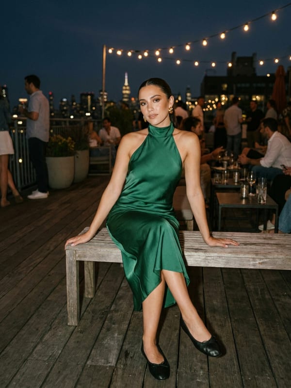 An emerald satin halter dress, midi length, with flats